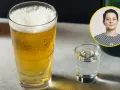 Kobieta w okręgu i kieliszek wódki obok piwa. Zastanawiasz się nad badaniami wątrobowymi na alkohol ile nie pić?